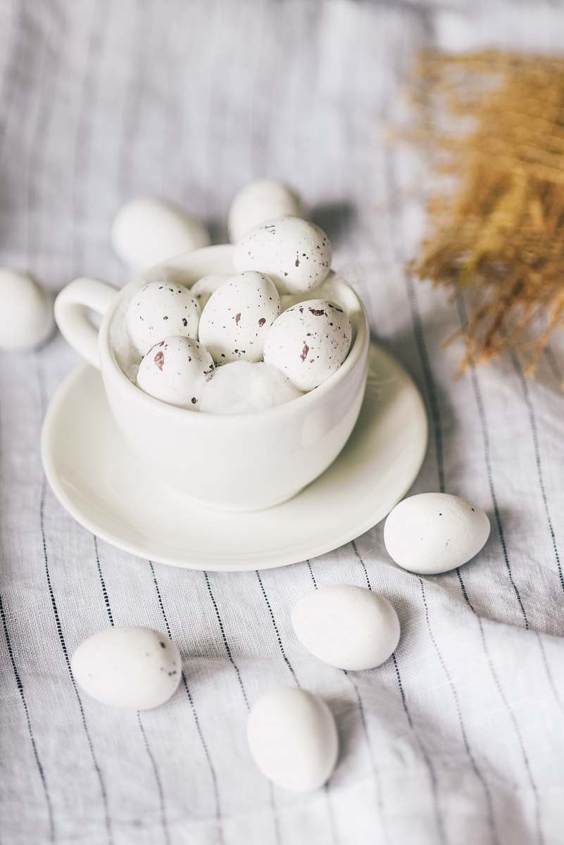 belgium small eggs on table and in the cup easter