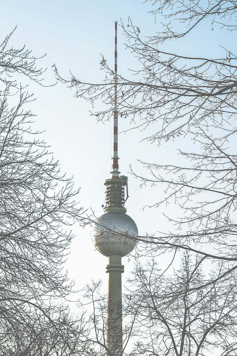 architecture Berlin Tower captured with bare trees under clear blue sky tower