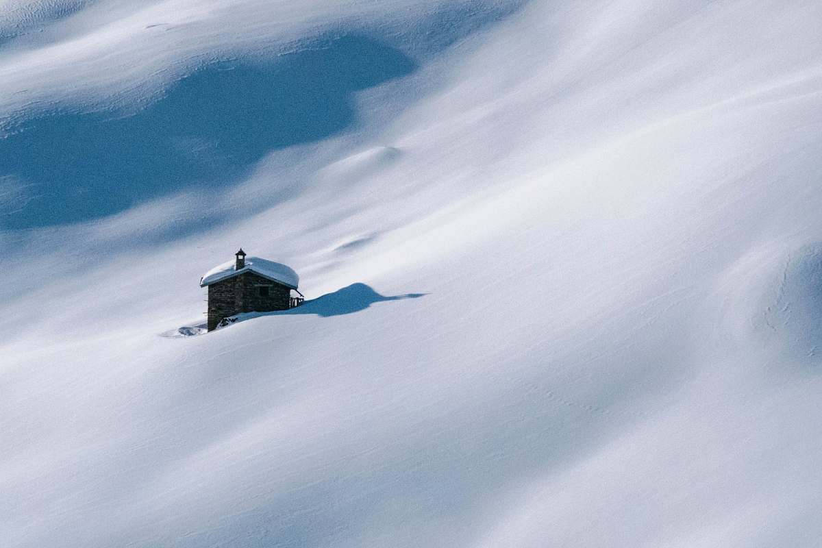 snow brown house covered by snow hut