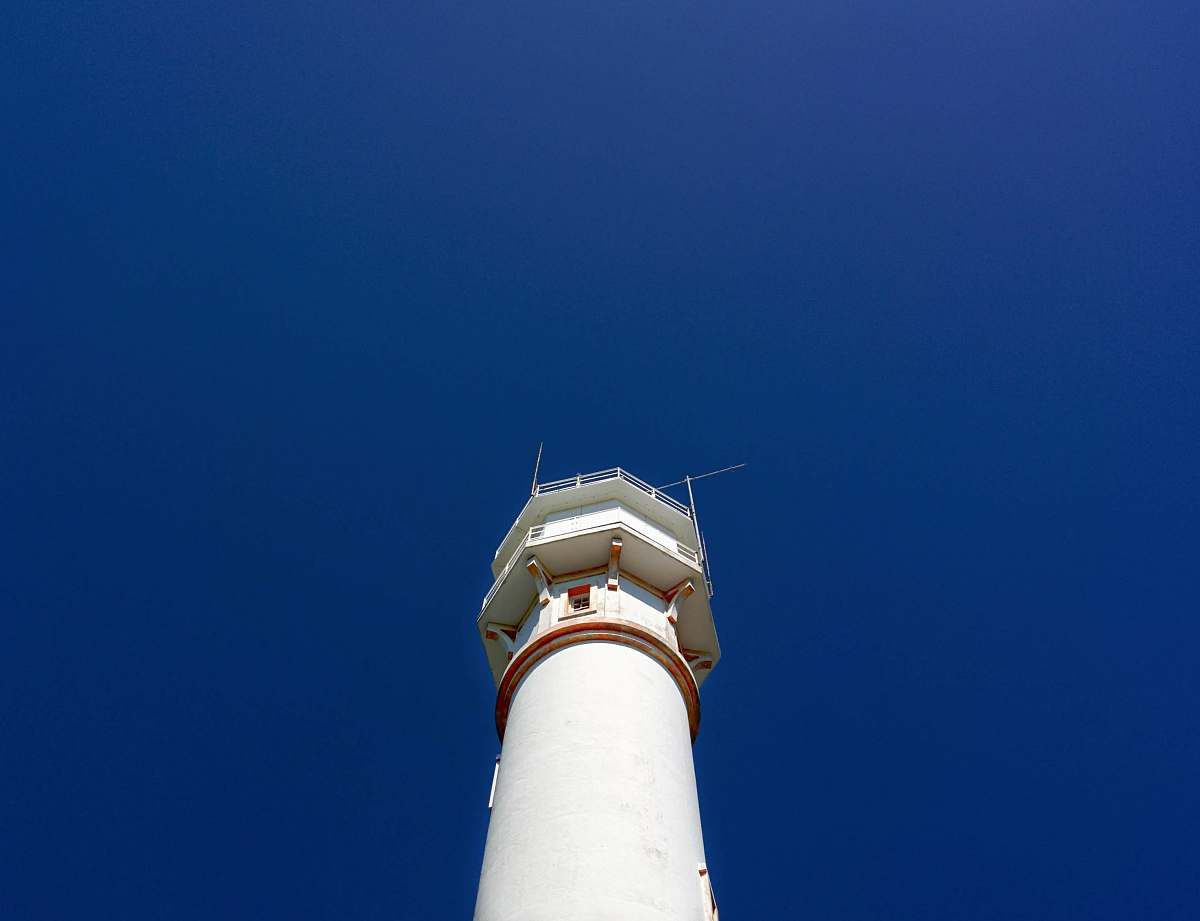 architecture closeup photo of white lighthouse beacon