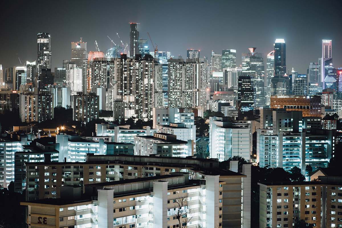 city lighted city buildings during nighttime high rise