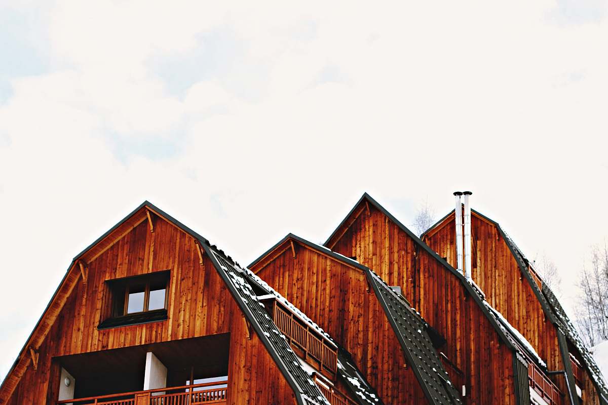 nature low angle photo of brown wooden house outdoors