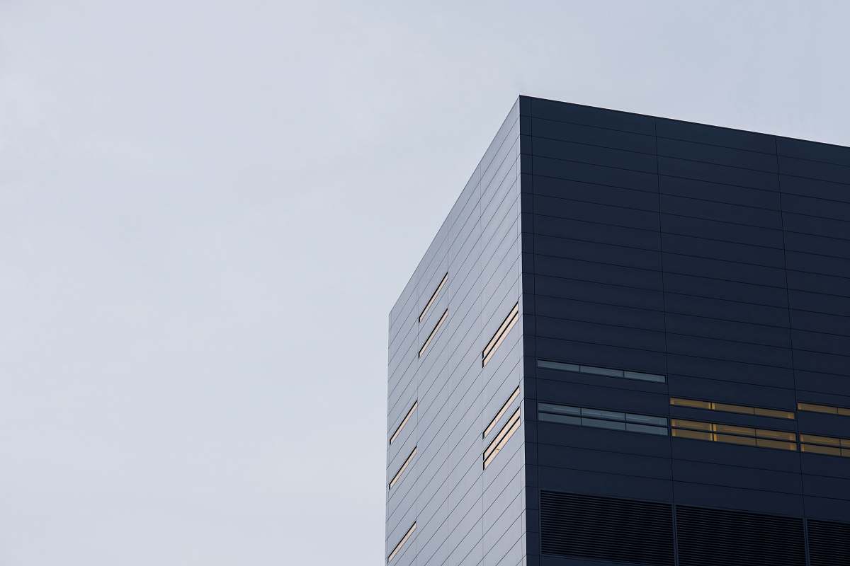 grey low angle photo of curtain glass wall building office building