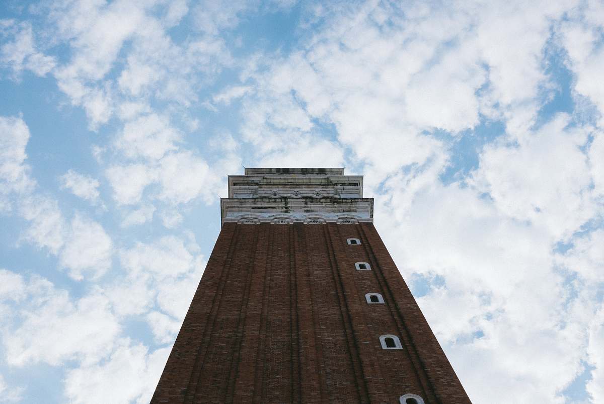 tower low angle photography of brown painted building architecture