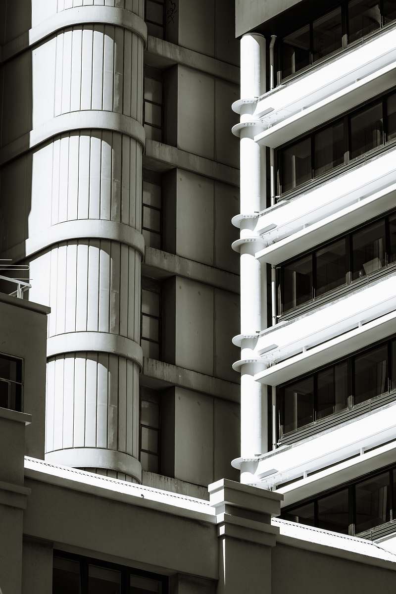 window low-angle photography of concrete building during daytime office building