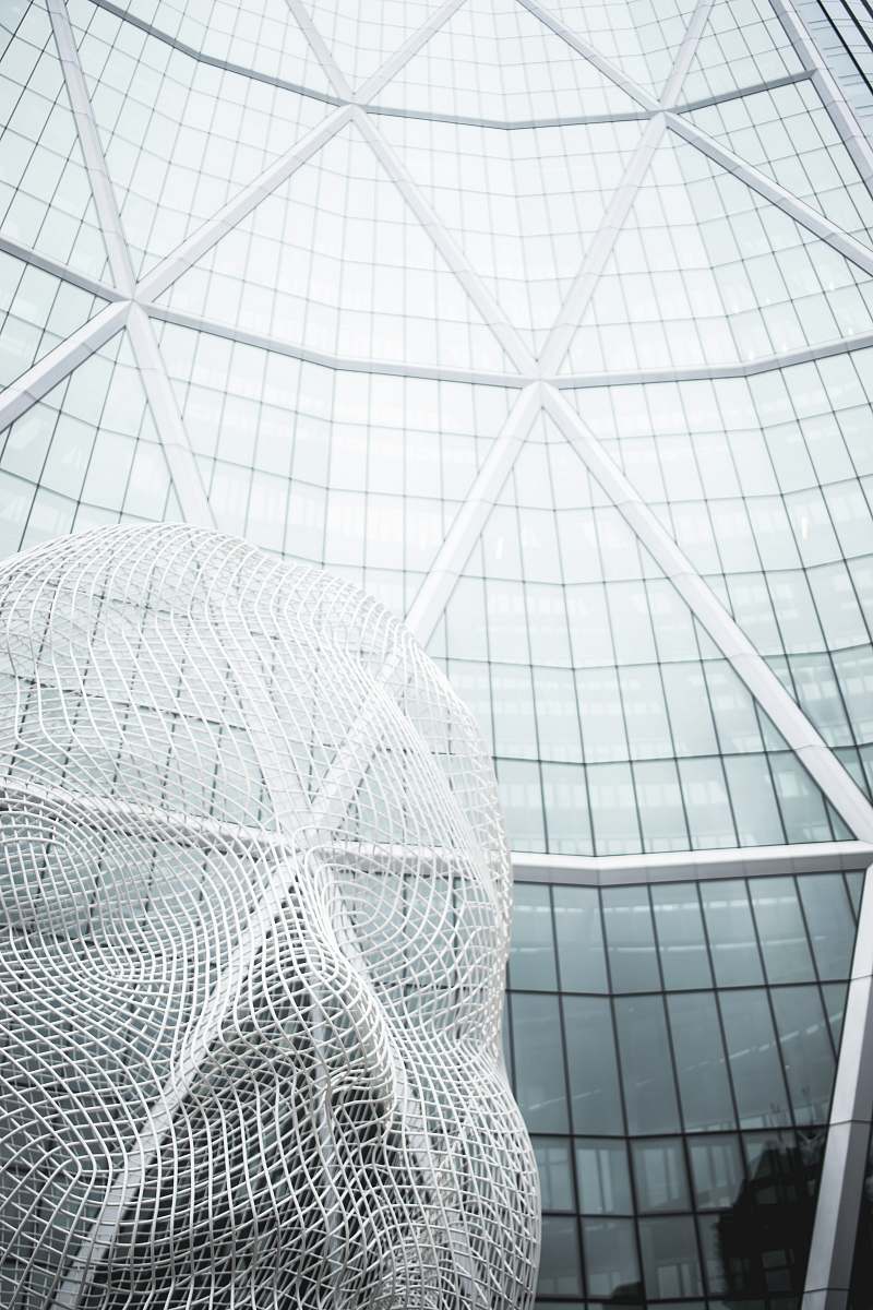 architecture low angle photography of glass building calgary