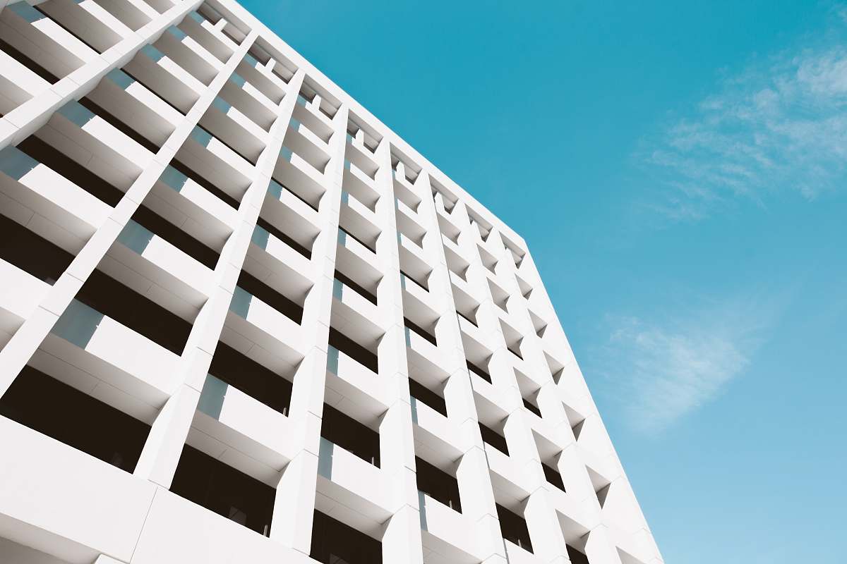 atlanta low angle photography of white building under blue sky housing
