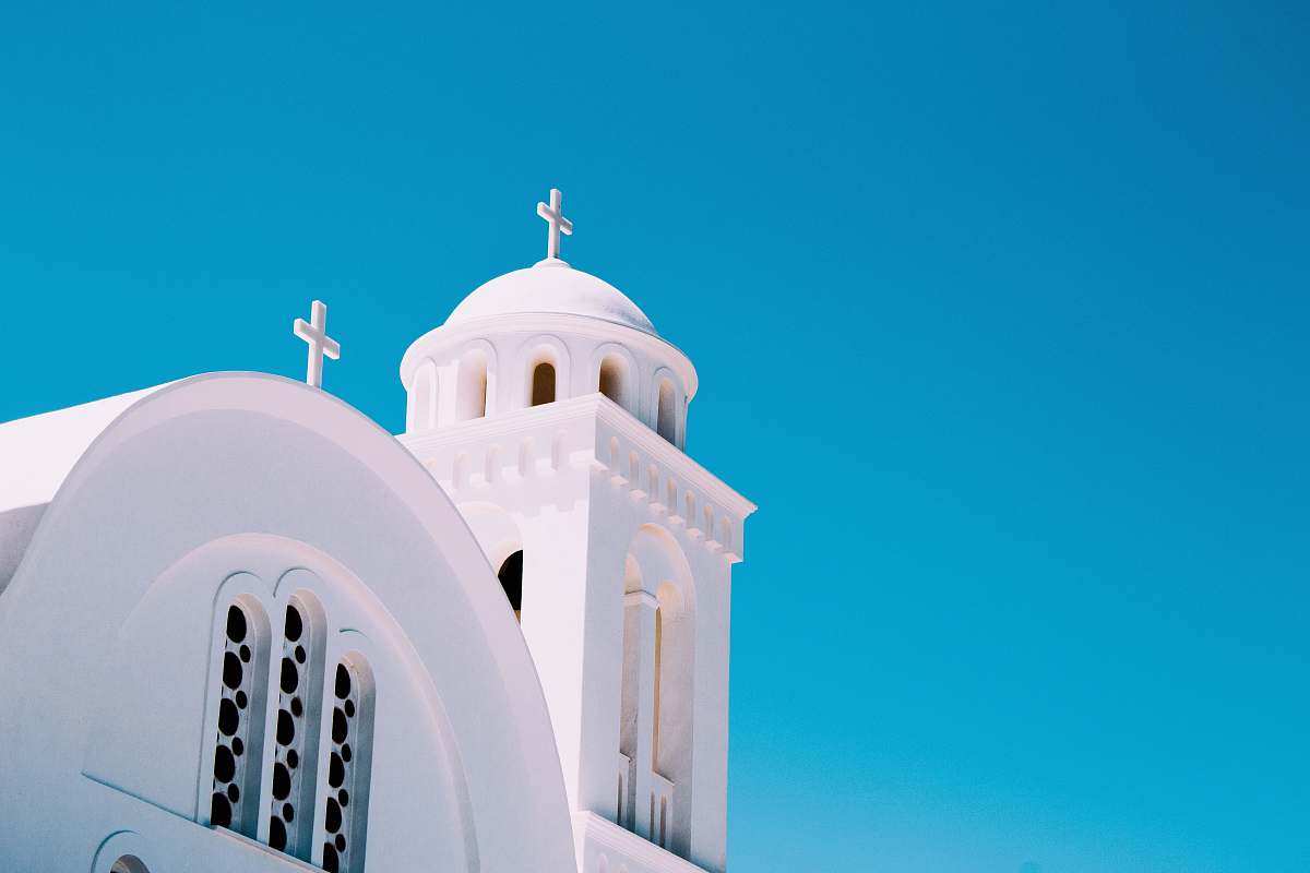 architecture low-angle photography of white church tower