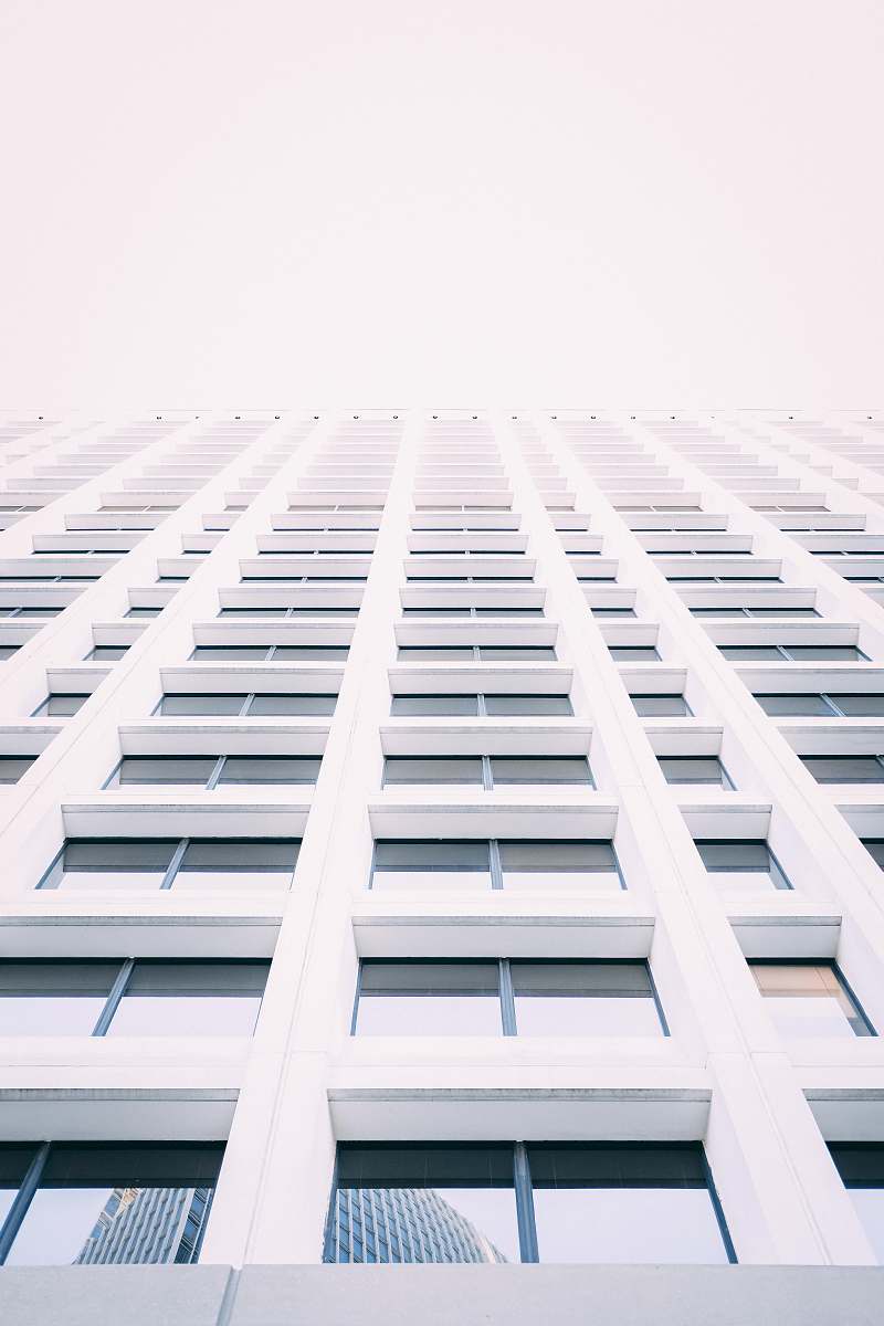 city low-angle photography of white concrete building urban