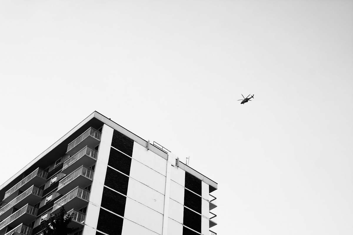 black-and-white low angle view photography of helicopter sky