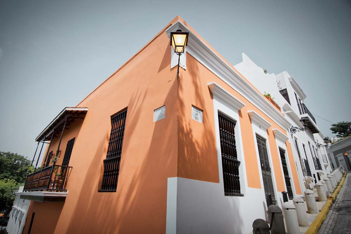 city person in front of brown and white concrete building puerto rico