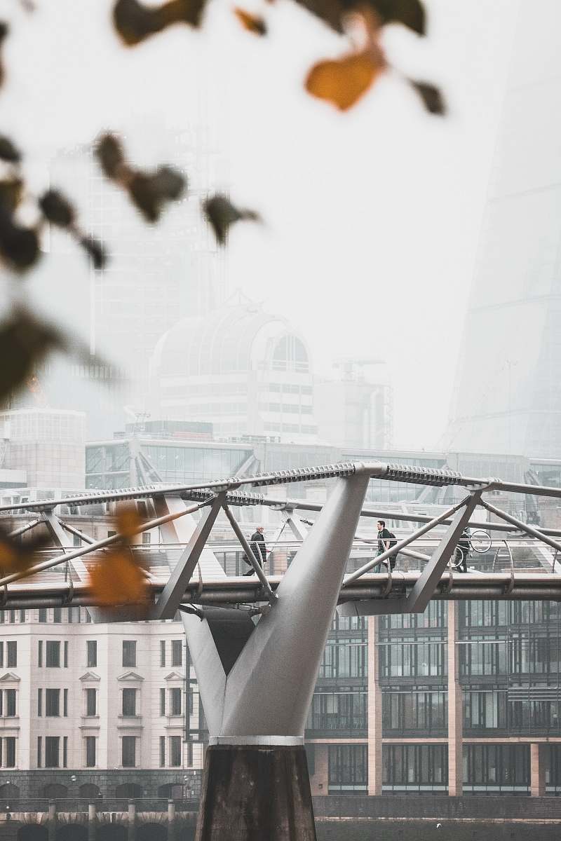 architecture photo of man walking on gray bridge london