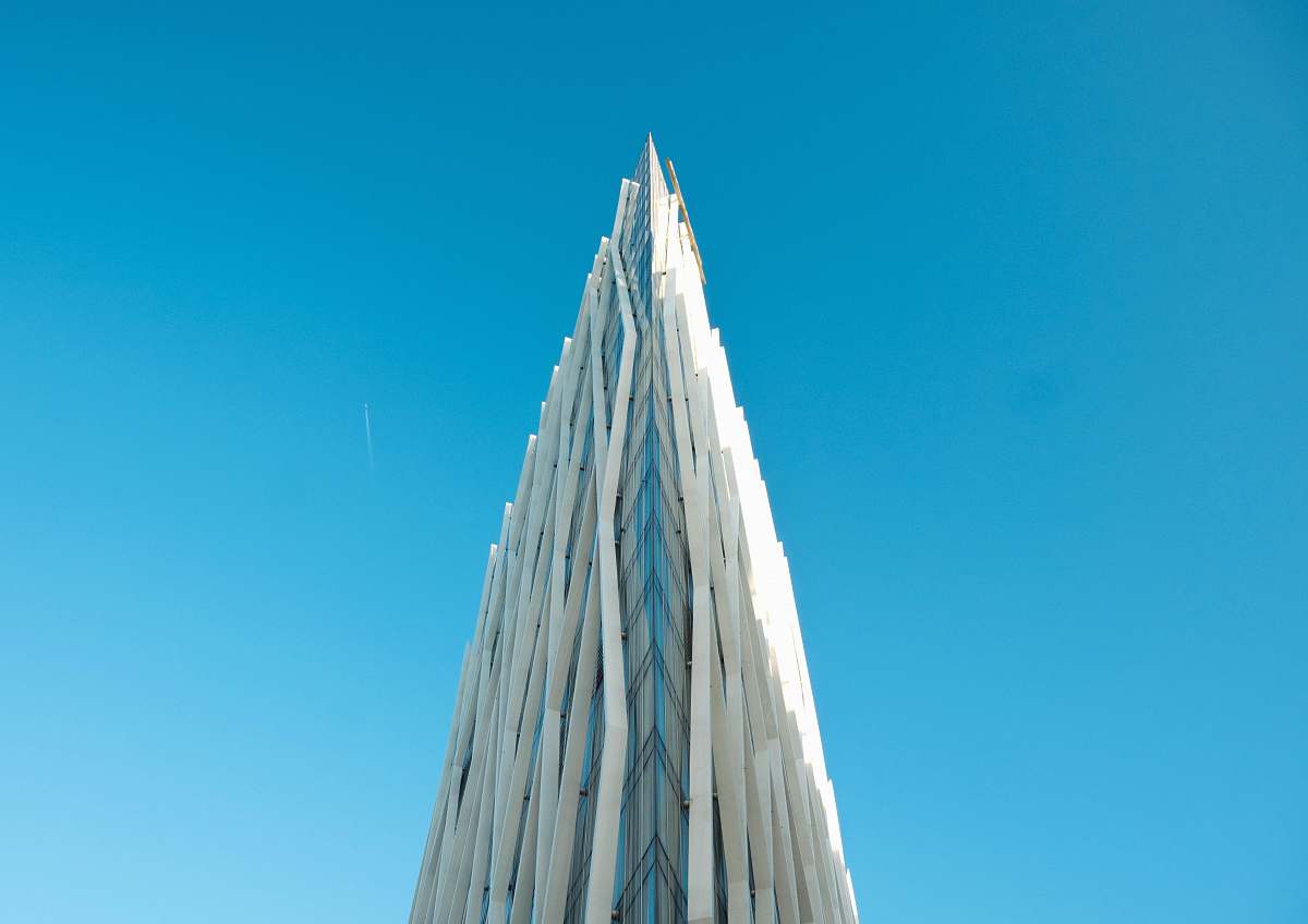 tower photography of white building under clear blue sky architecture