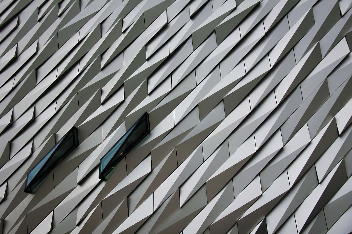 grey Undulating abstract shapes on a building facade at The Titanic Memorial Garden. pattern