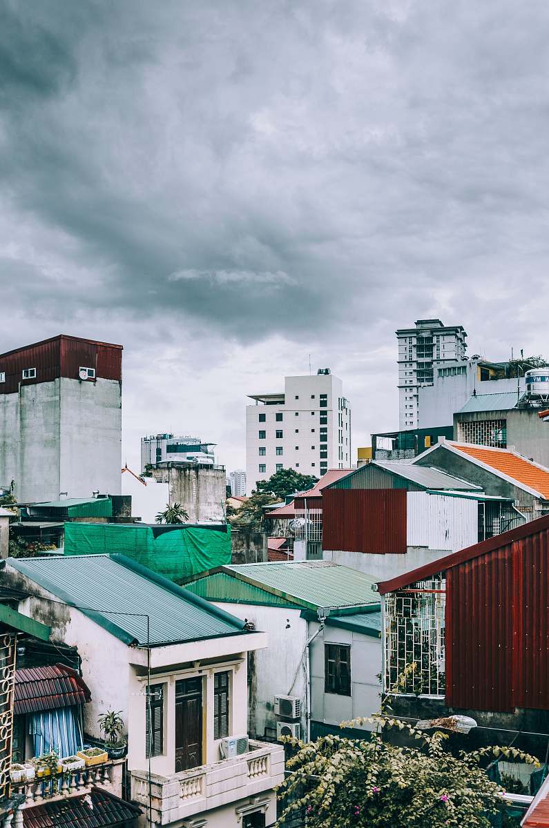 hanoi white and gray concrete mid-rise buildings under gray clouds vietnam
