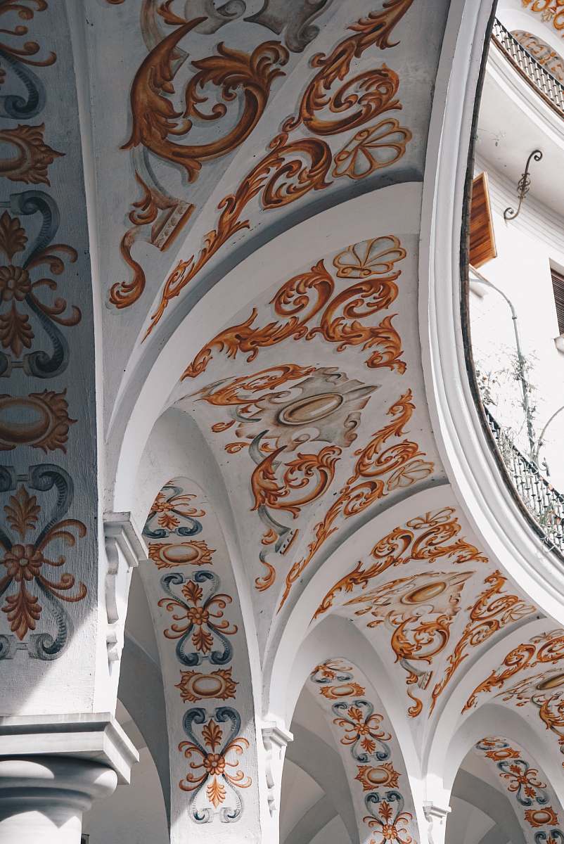 architecture white and orange floral ceiling arch