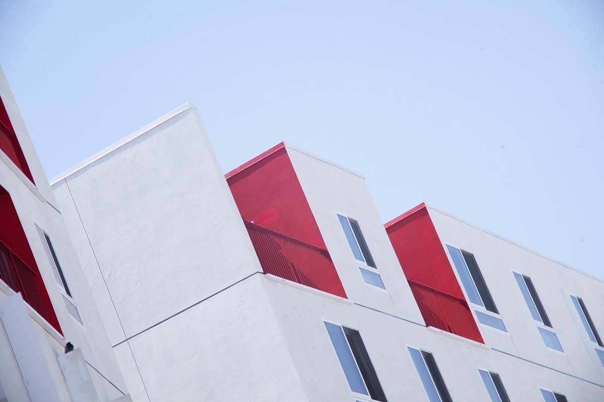 red white and red concrete building photo architecture