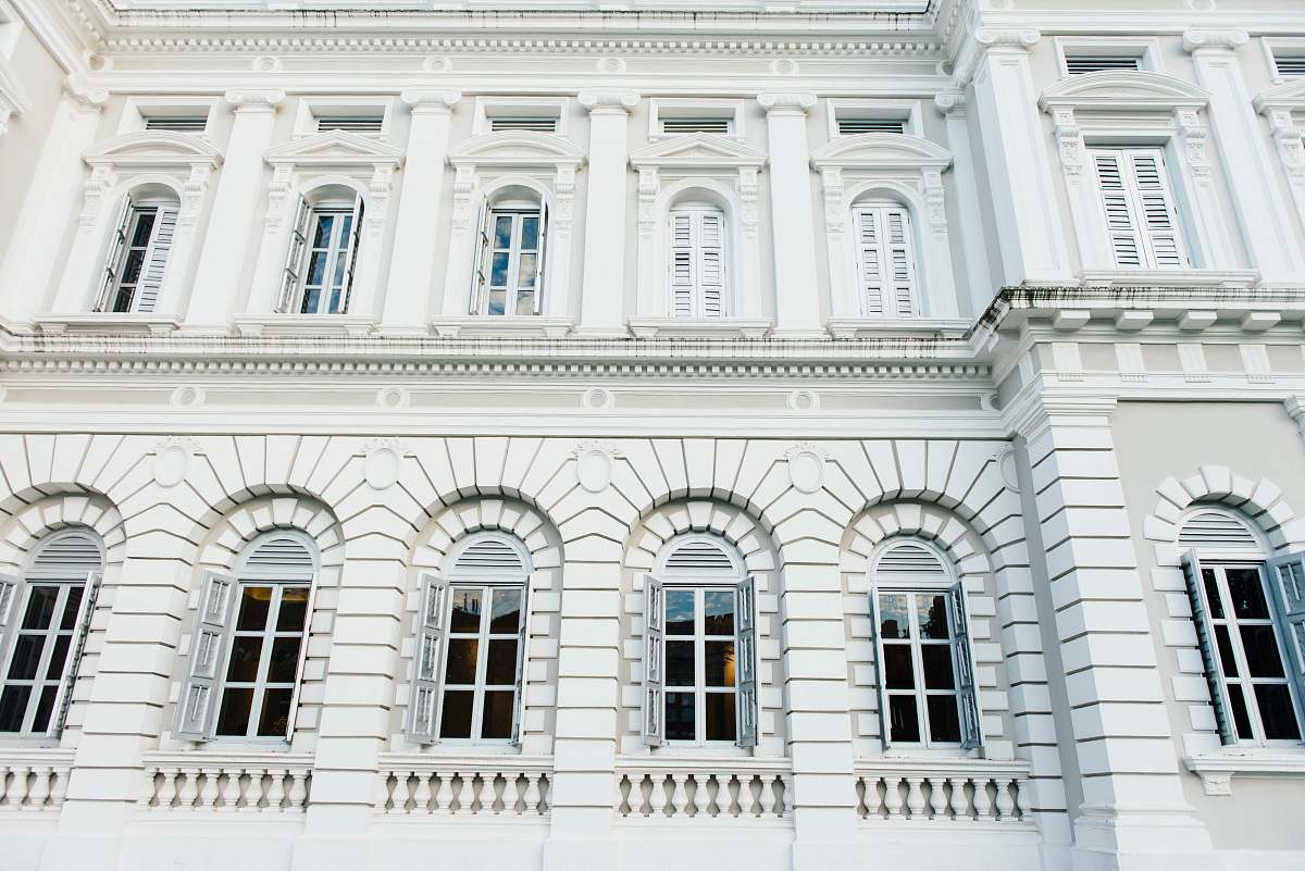 architecture white concrete building with sash window window