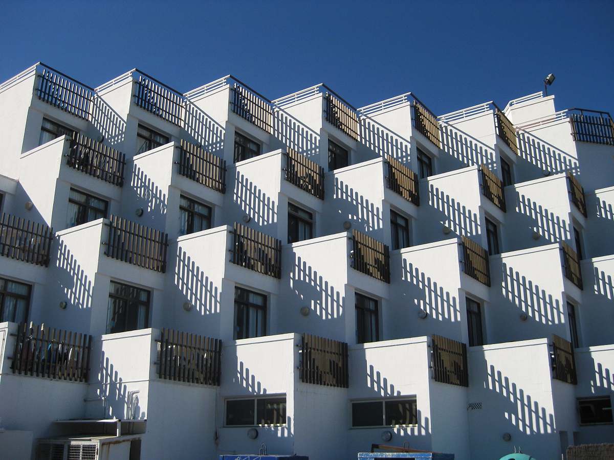 architecture white concrete houses under blue sky apartment building