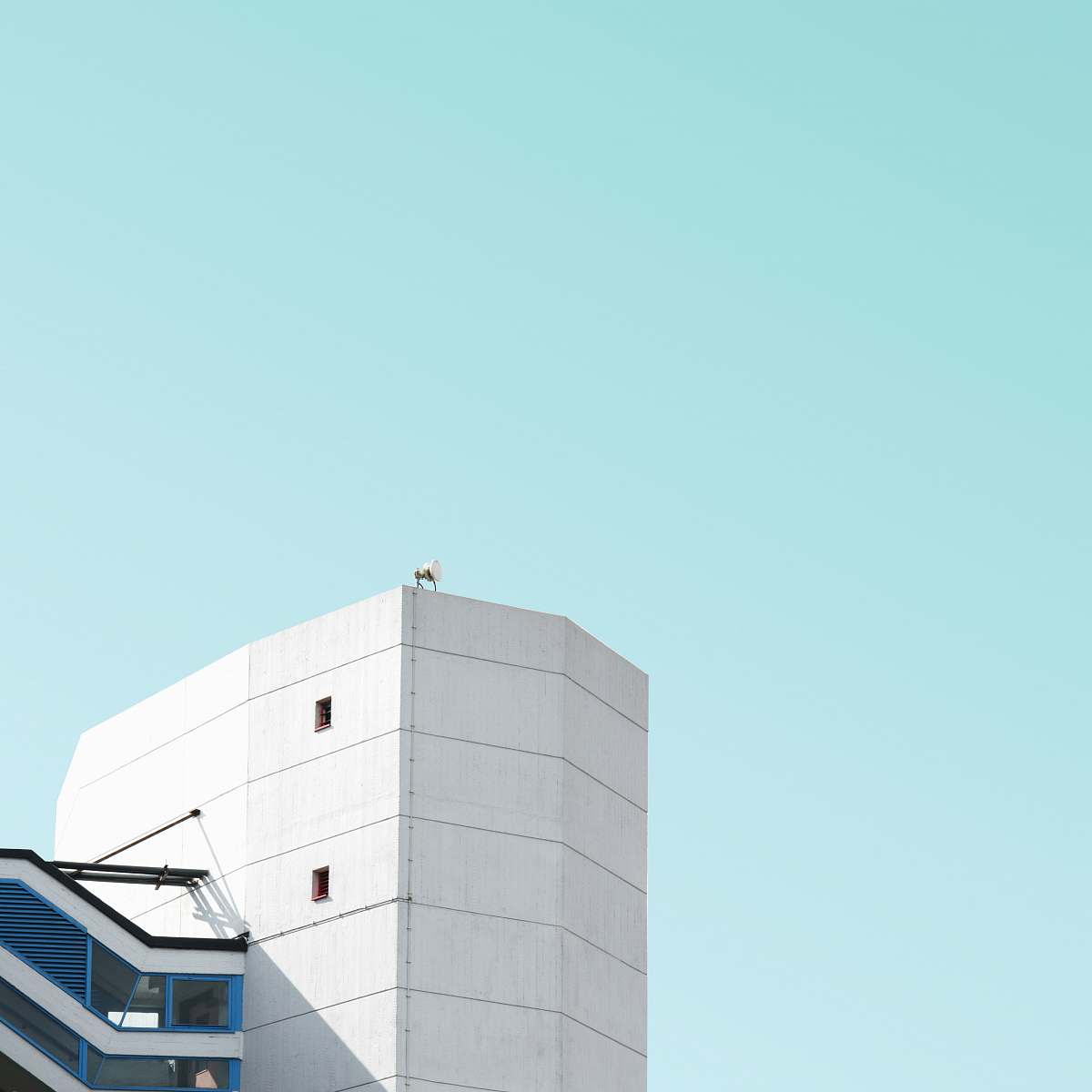 london white painted concrete building taken at daytime office building