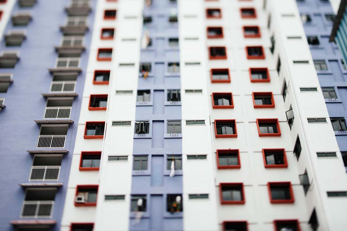 housing worm's eye view of white and gray building during daytime urban