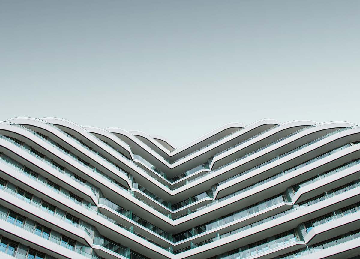 grey worm's eye view of white building housing