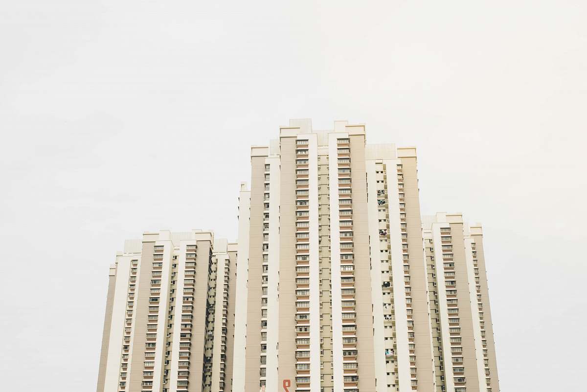 city worm's eye view photography of white building housing