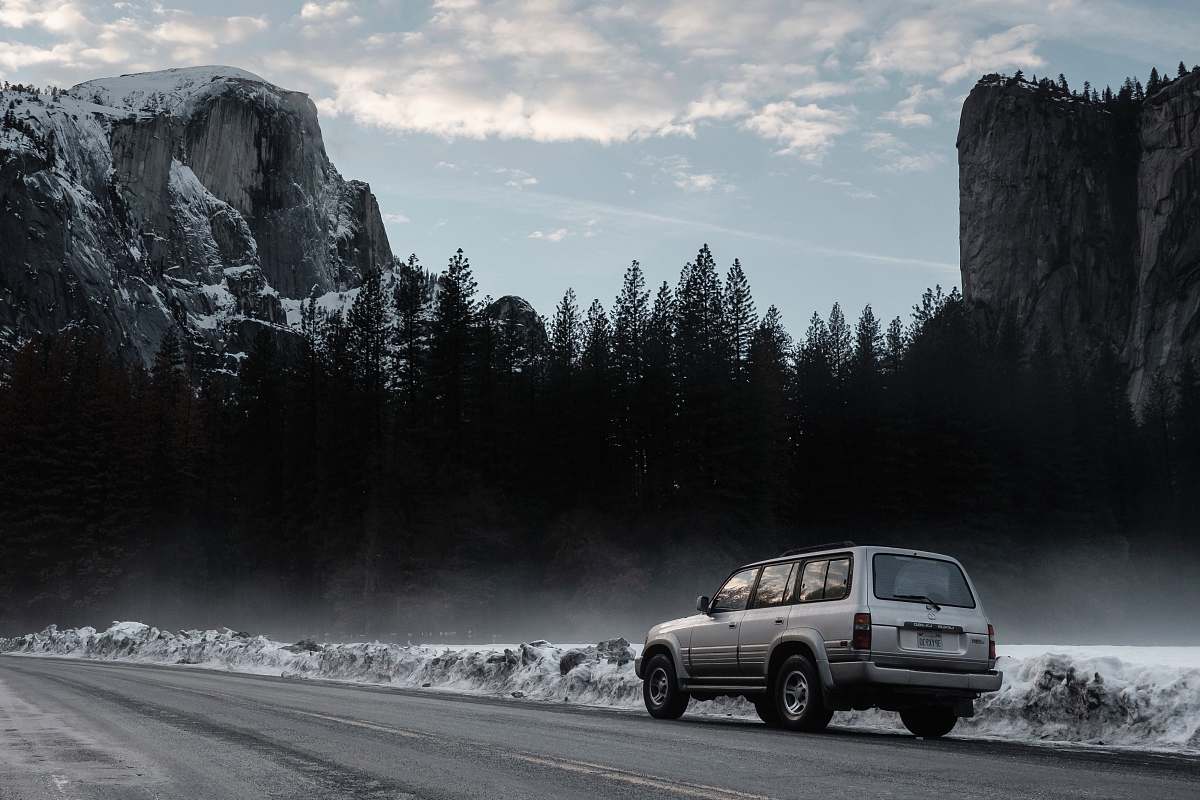 automobile gray sport utility vehicle on road road