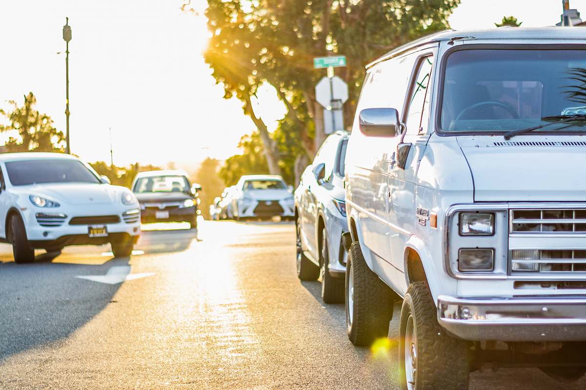 vehicle parked white van automobile