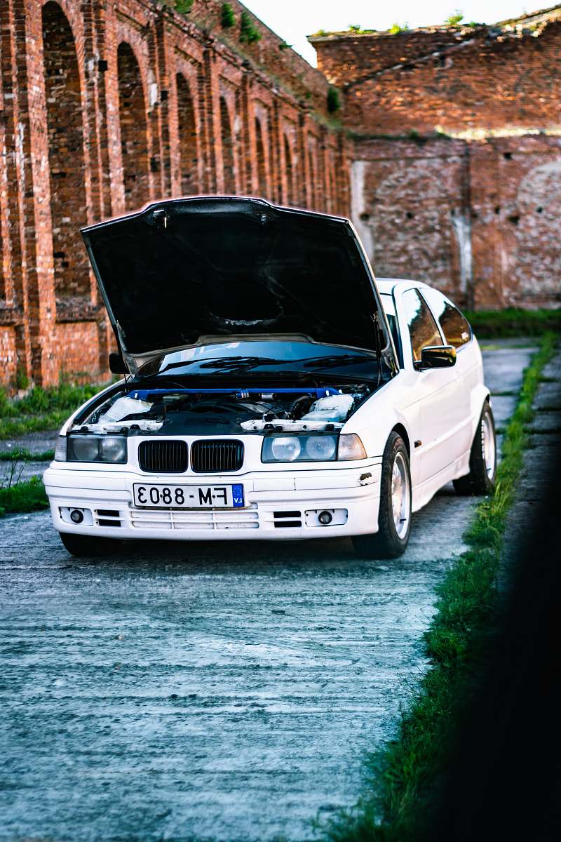 automobile white BMW car transportation
