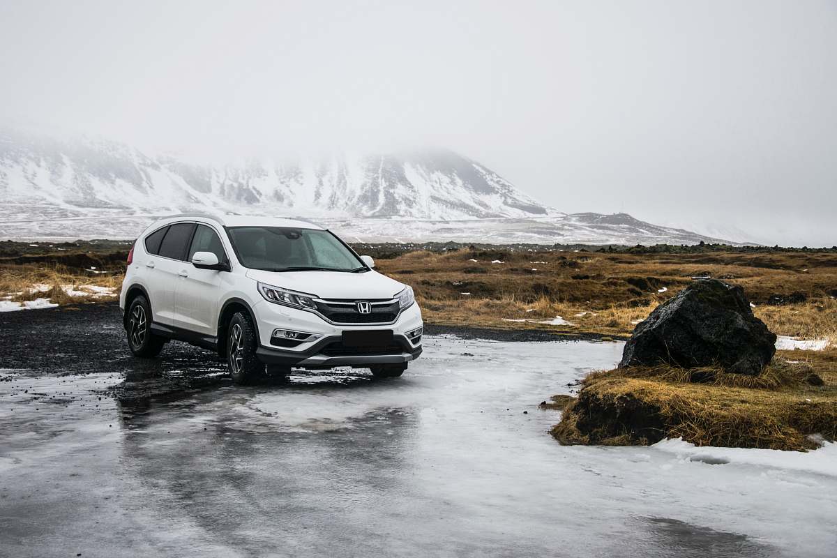 suv white Honda SUV on gray floor automobile