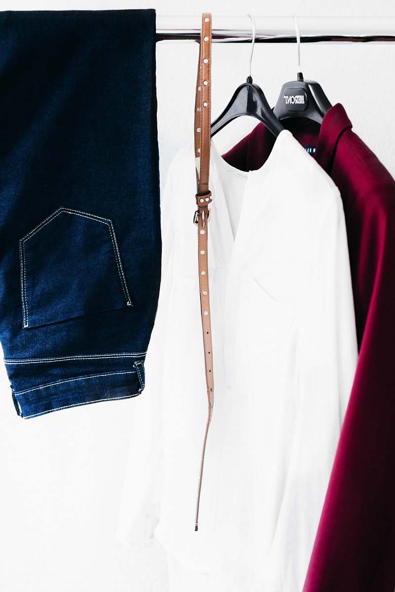 denim two white and red long-sleeved shirt with belt and jeans jeans