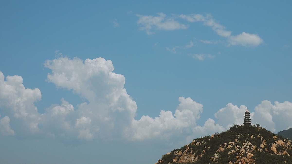 nature white clouds over black pagoda during daytime sky