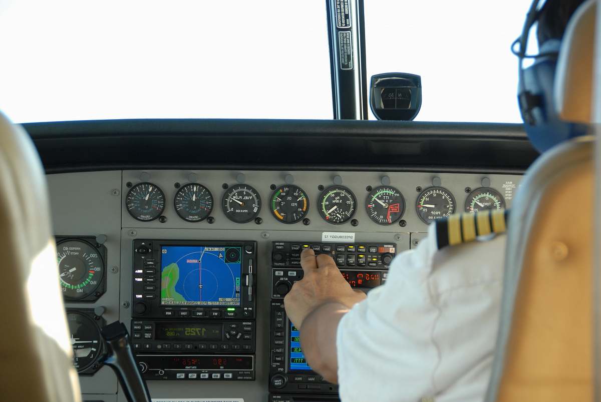gauge pilot controlling airplane dashboard tachometer
