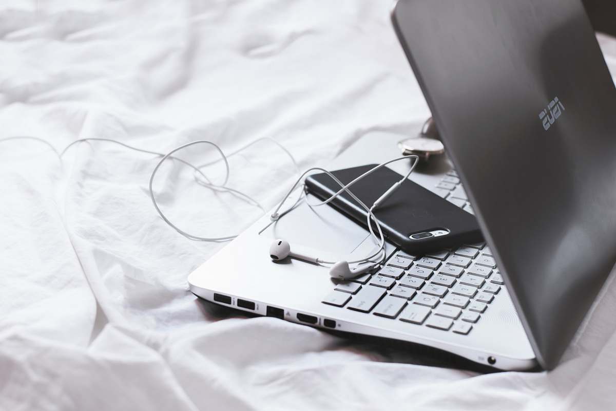electronics iphone face down on laptop keyboard pc