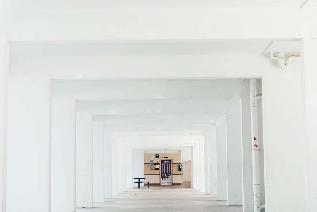white cabinet and table inside white concrete building building