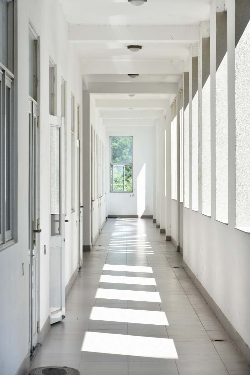 grey doors closed at hallway floor