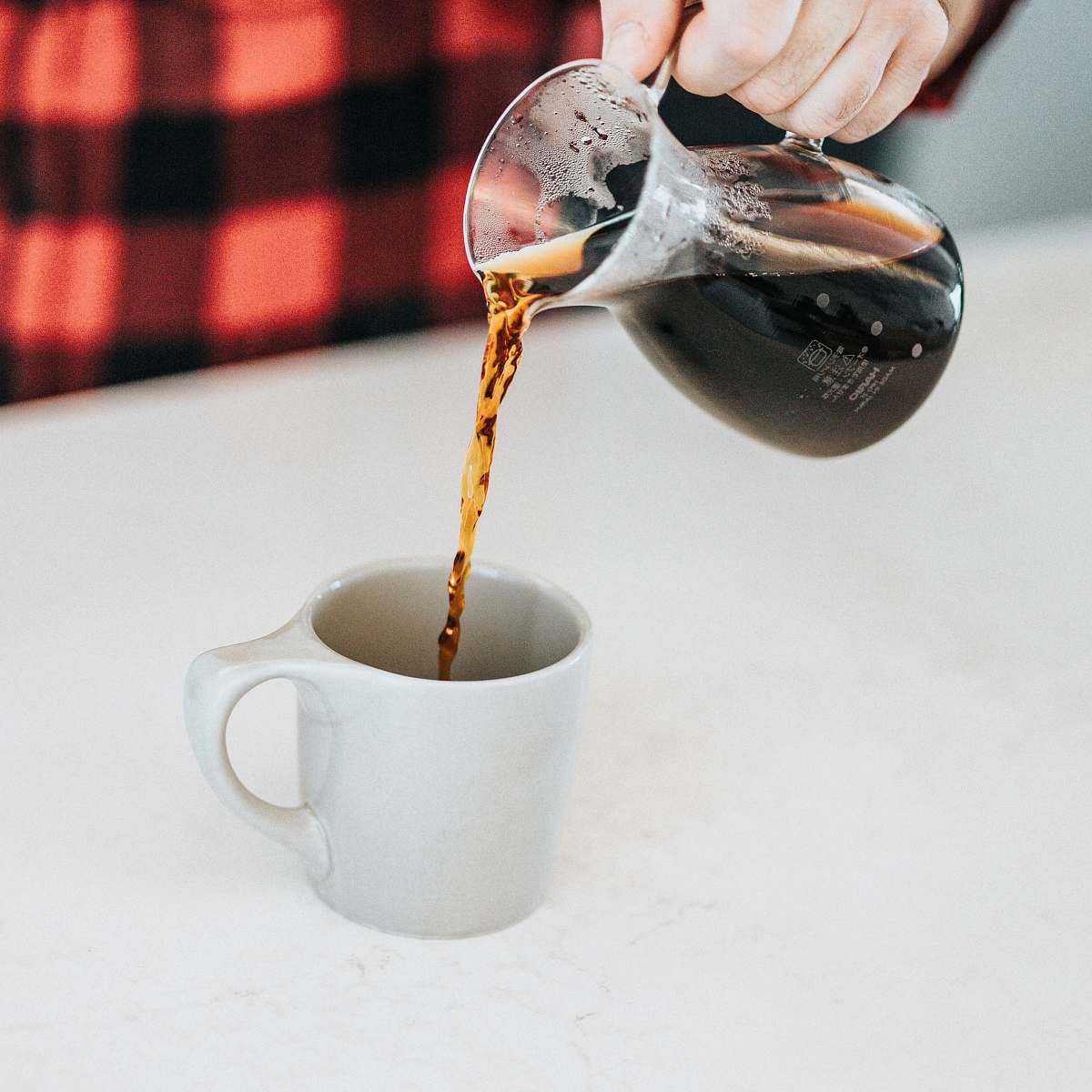 coffee person holding glass pitcher drink
