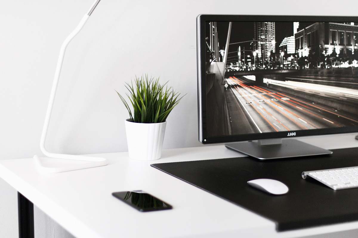 indoors white plant pot beside desk lamp interior design