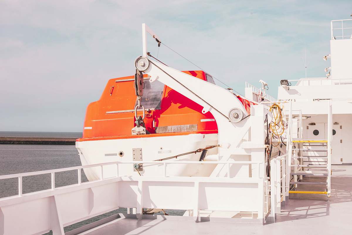 france white ship on body of water during daytime orange