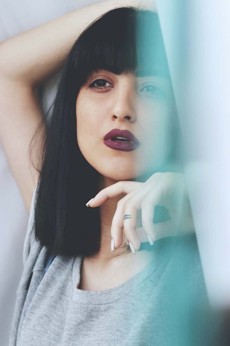 human woman wearing grey crew-neck shirt person