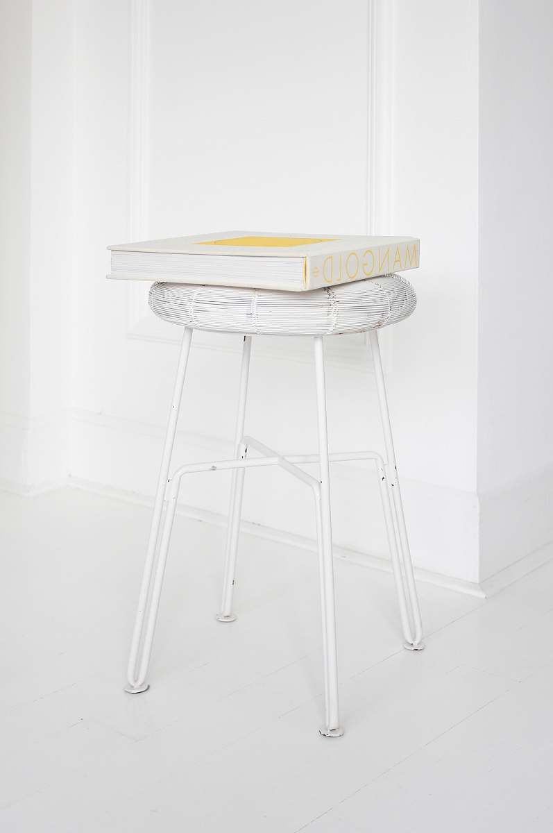 white Mangold box on white stool minimal