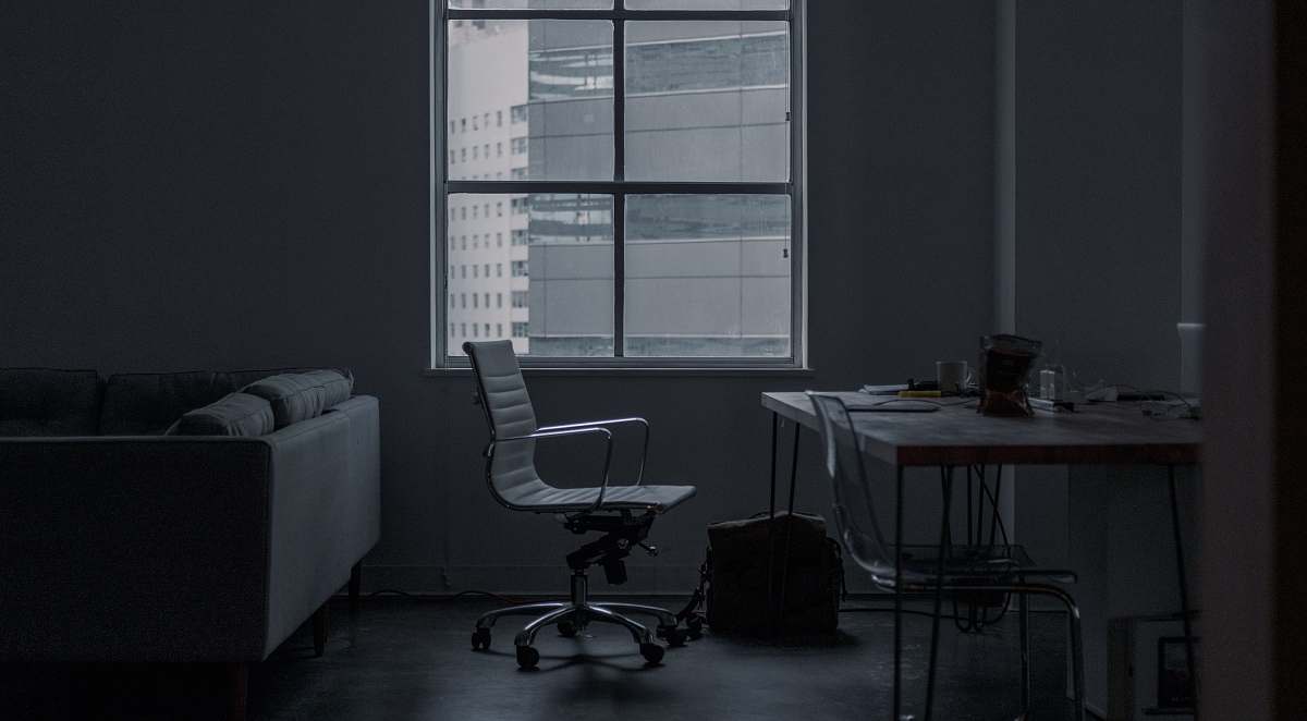 chair white rolling armchair in front of table couch