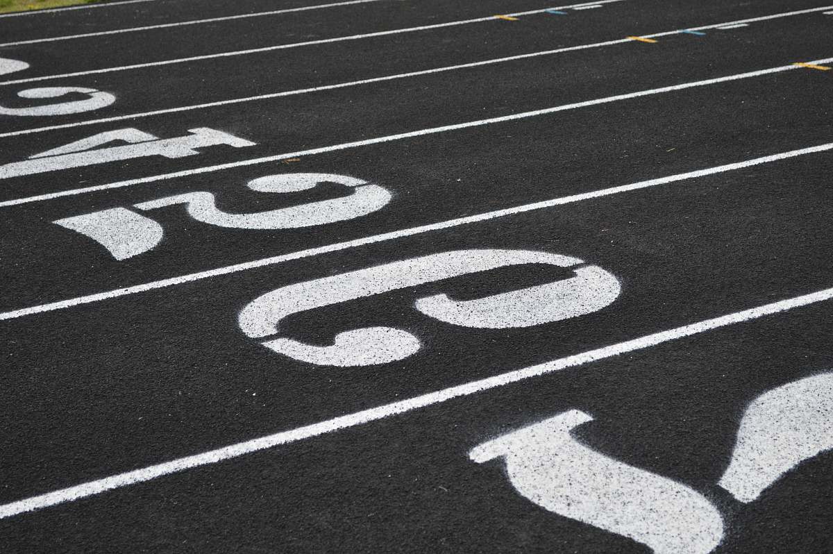 tarmac aerial view photography of number on ground asphalt