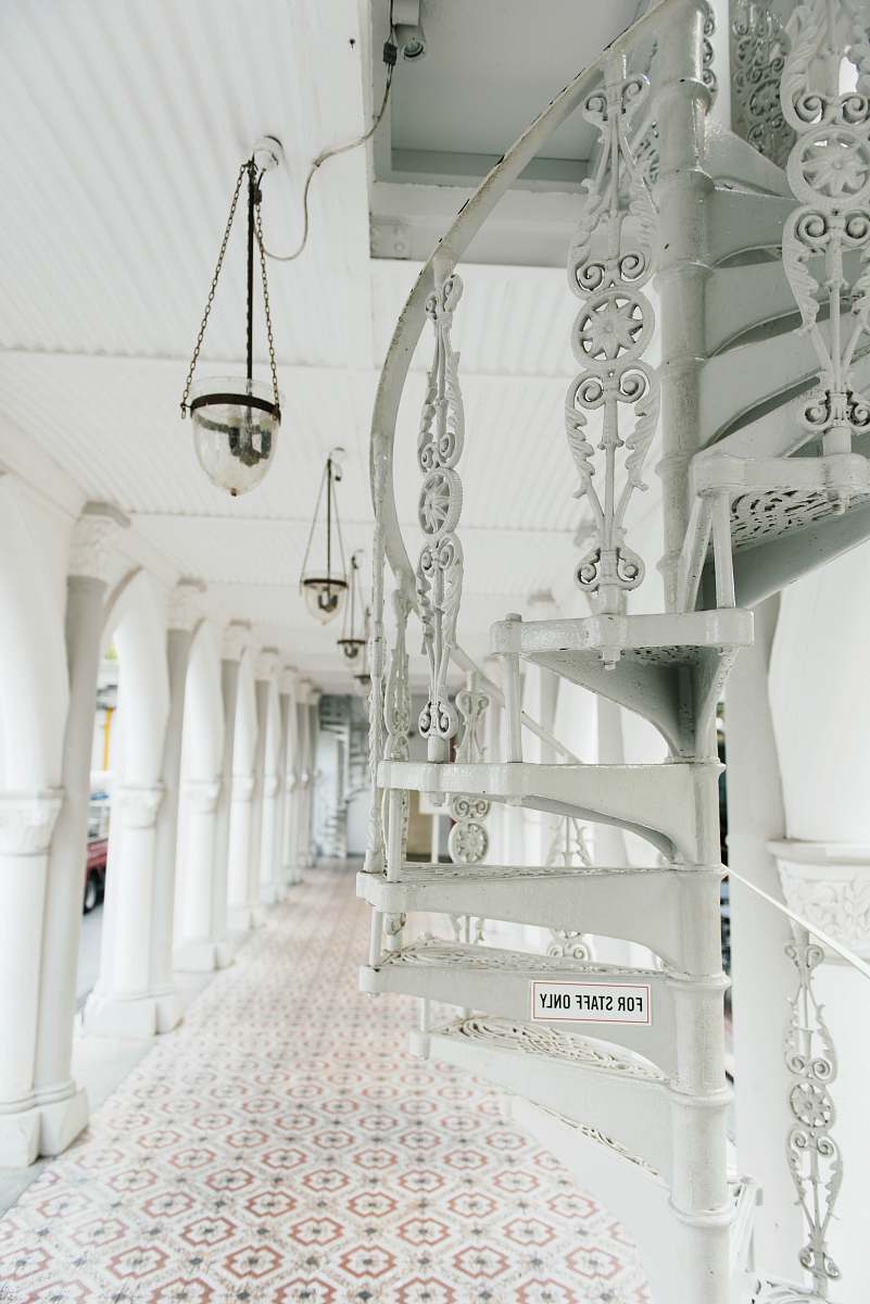 corridor brown and white pendant lamp near white spiral stairs in hallway spiral