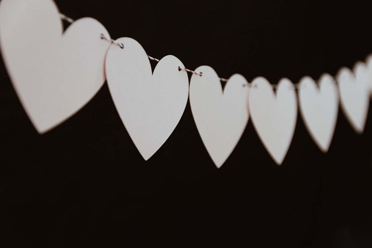 love closeup photo of white heart bunting valentine