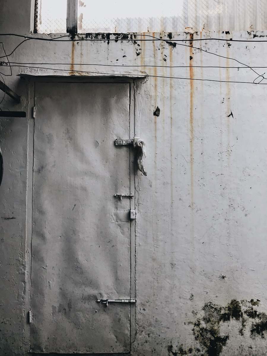 wall gray door and gray painted wall rusty door