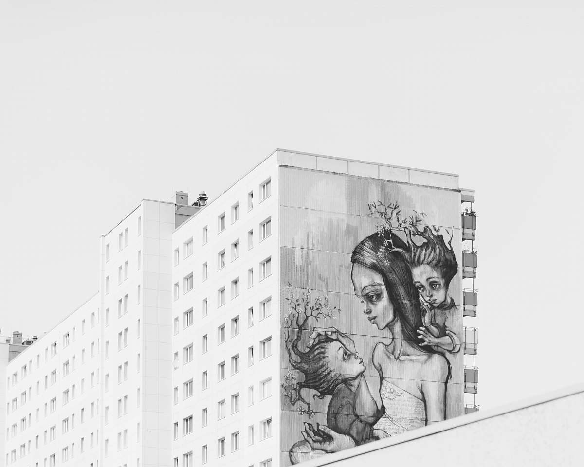 black-and-white grayscale photo of painted building art