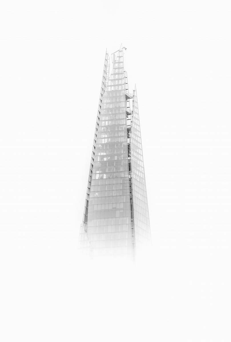 black-and-white high-rise building with fogs architecture