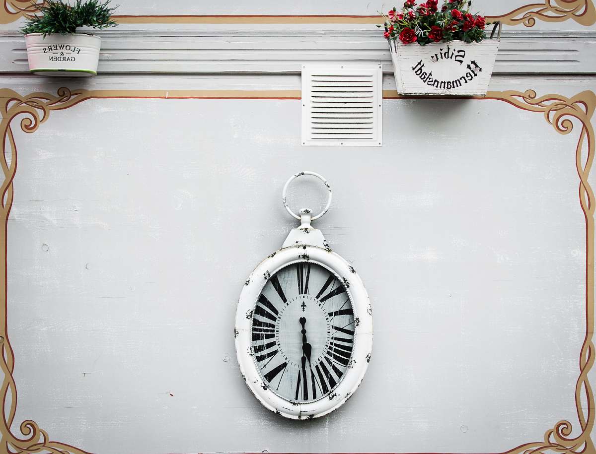 clock oval white analog clock display at 6 o'clock gold